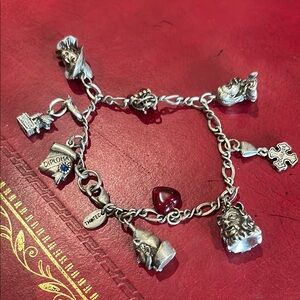 Red and Silver Charm Bracelet with Intricate Designs